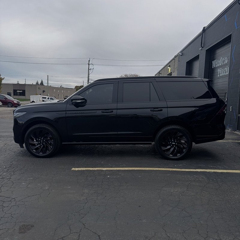 Blacked-Out SUV — Full Tint