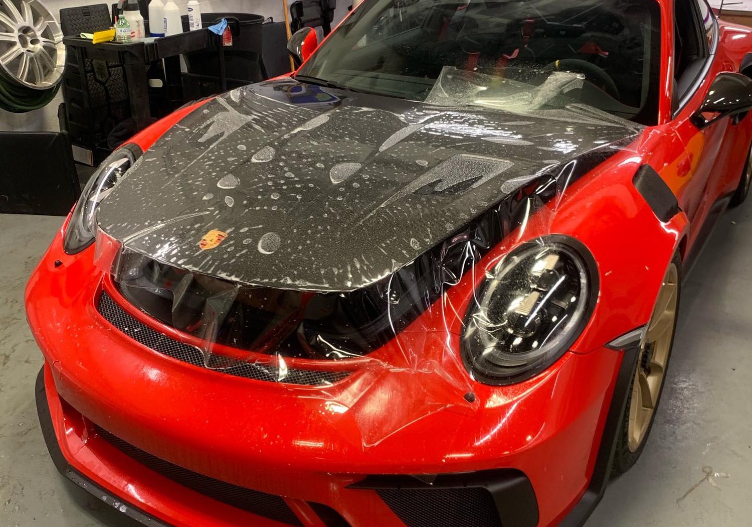 Paint protection film going onto a Porsche GT3 RS — NIKO Signs & GraFX, serving Guelph