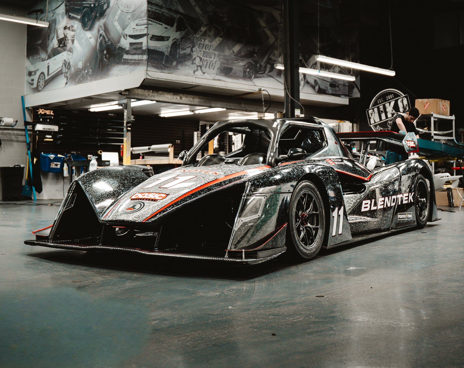 Blendtek Revolution race car in a custom printed livery, built at the NIKO shop in Waterloo